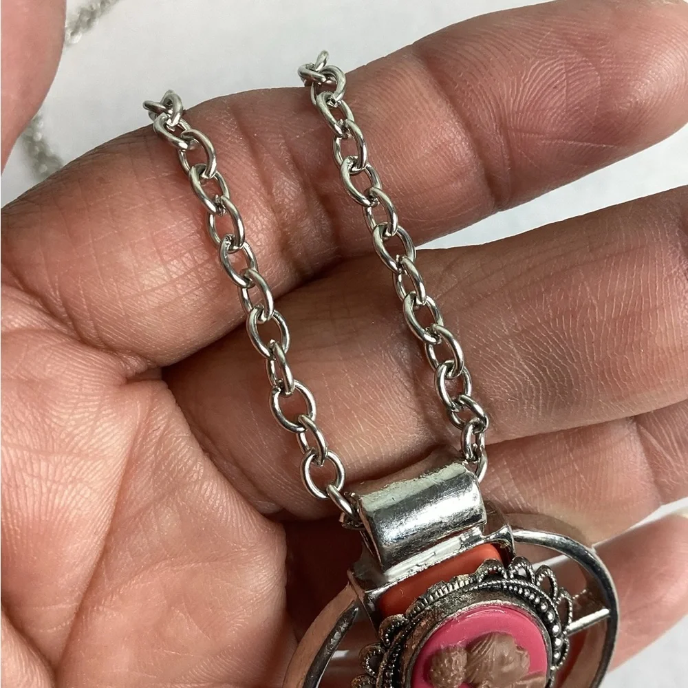 Pink and sliver cameo necklace.